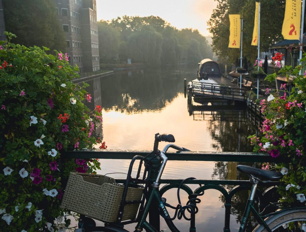 Bike leaning on rail with river in the background