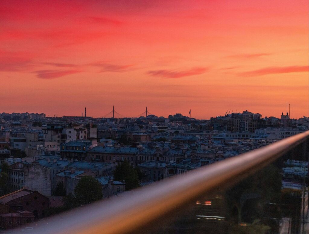 Orange sky viewed from a balcony