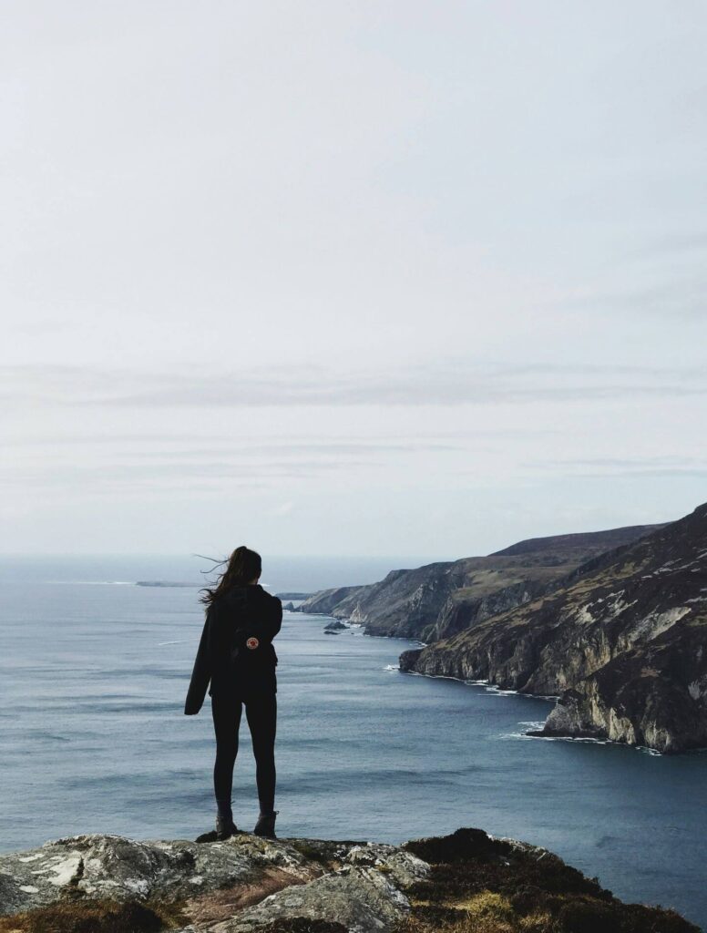 Girl looking towards ocean