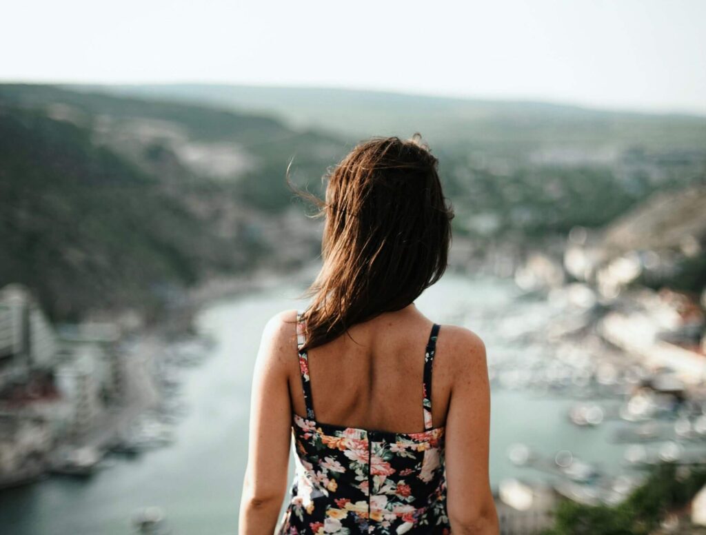 Girl looking towards lake