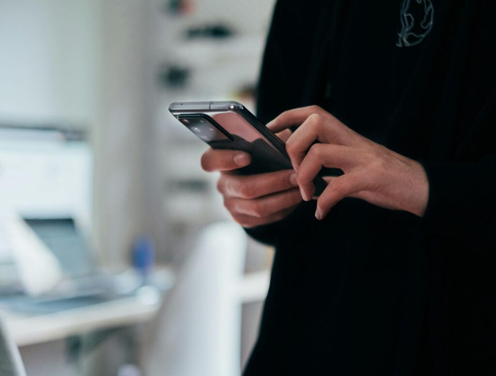 close up of person holding a cell phone
