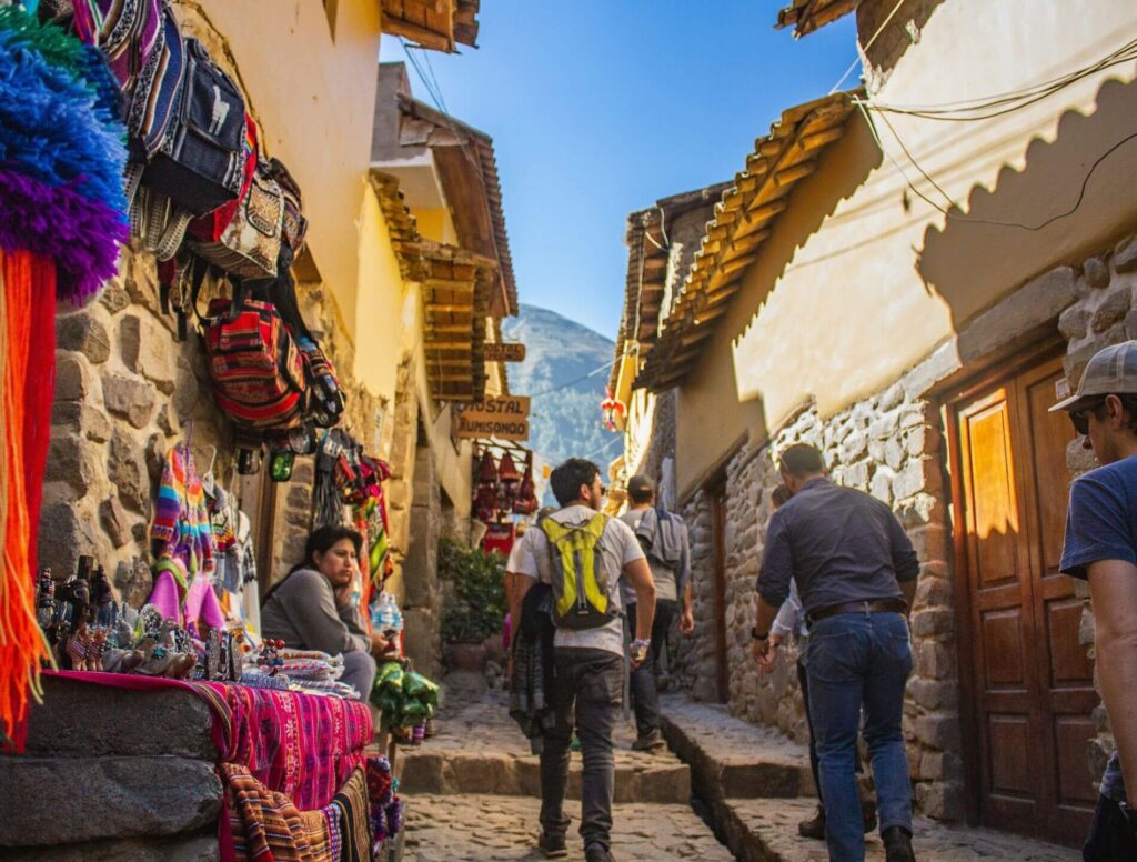 Cusco alleyway with people walking through it