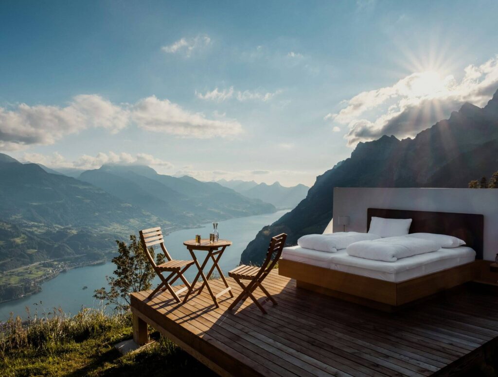 hotel room on outside deck overlooking lake and mountains