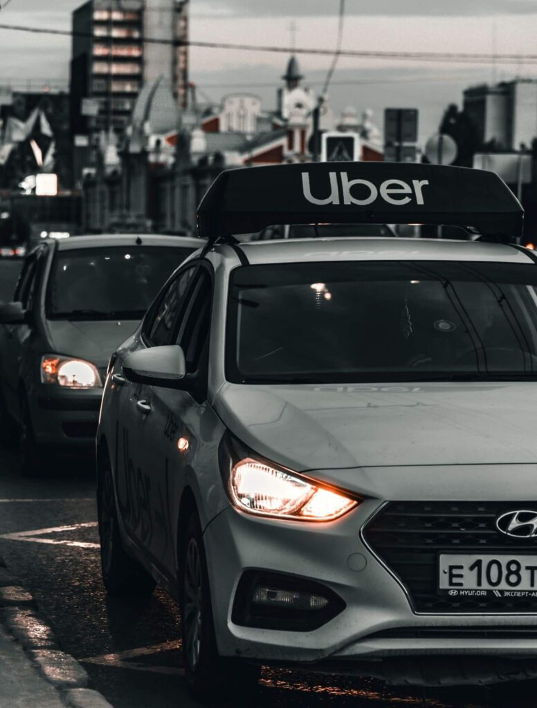 White car with Uber rideshare logo on top