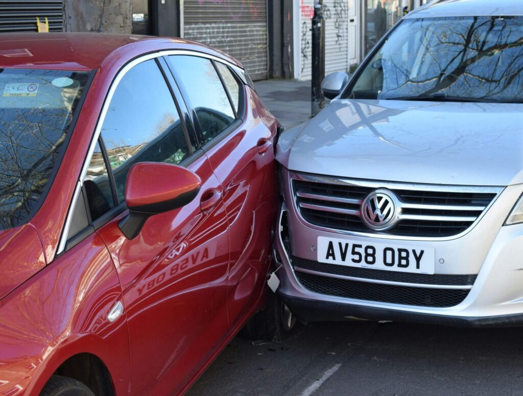 Red and grey cars involved in fender bender