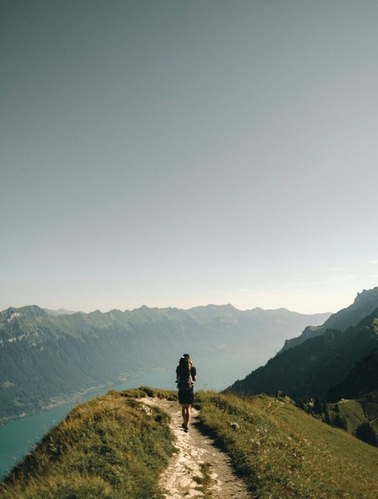 person hiking on a mountain trail