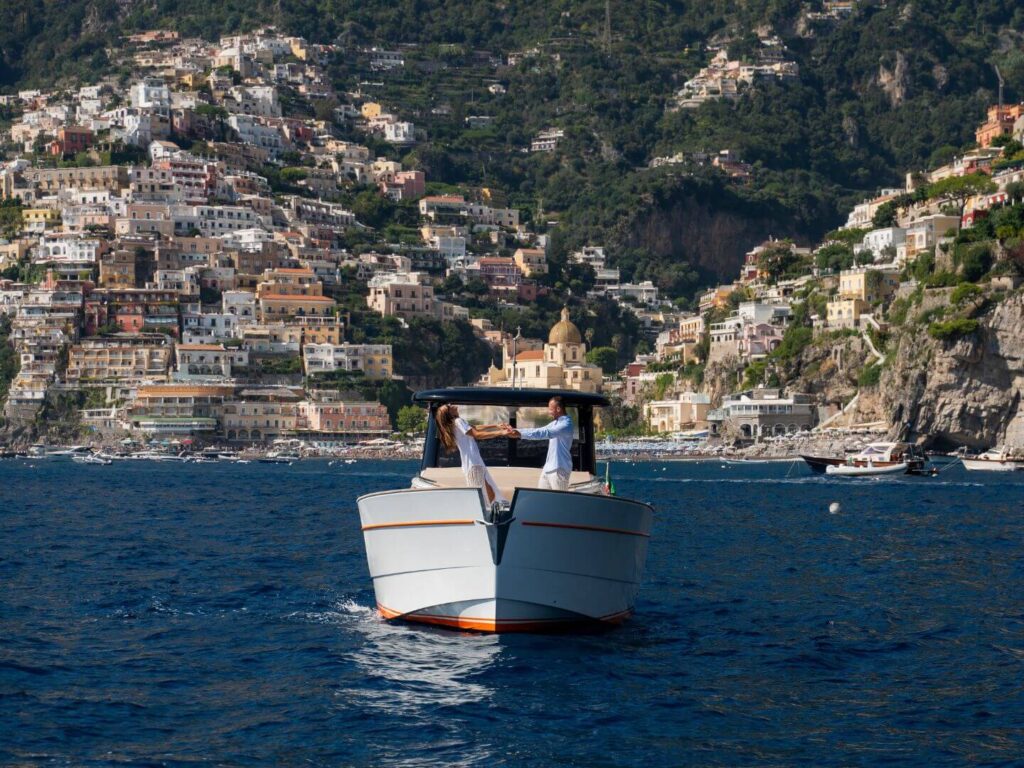 couple-on-boat-with-positano-in-background-amalfi-coast-pdg-boat-tour-copyright-adriano-alfaro-for-pdg-boat-tours-sorrento-riproduzione-vietata-reproduction-prohibited
